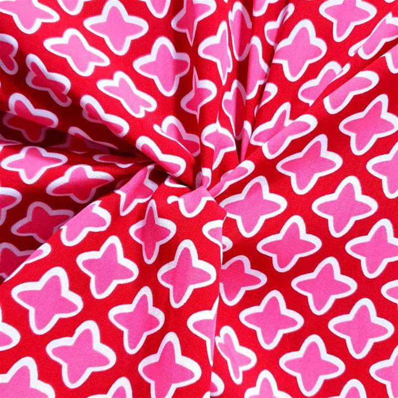 tecido de viscose estampado em tons de vermelho e rosa