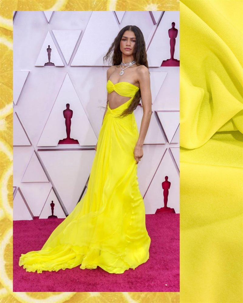 Atriz Zendaya usando vestido na cor amarelo brilhante com tecido crepe georgette